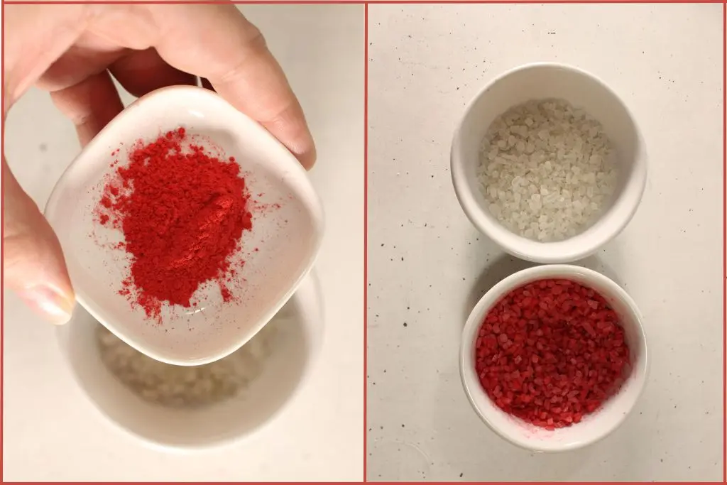 Close-up of red color powder being added to white bath salts in a small bowl (left), and two bowls of finished bath salts on a white surface (right), one plain white and one tinted red for candy cane bath salts.