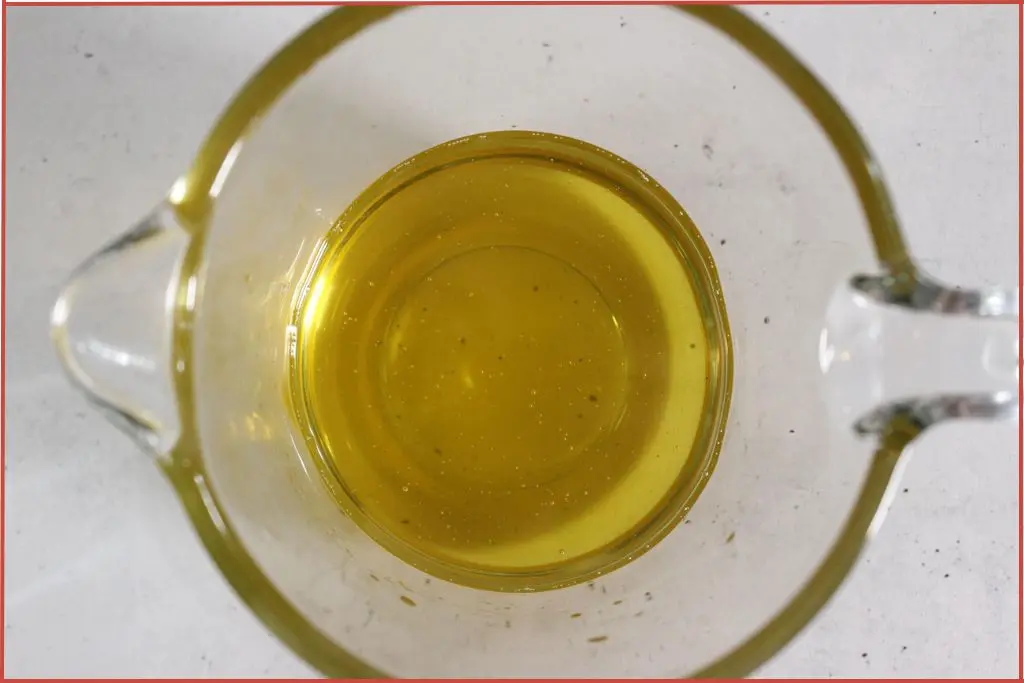 Top view of melted butters in a glass jar to make whipped hand cream